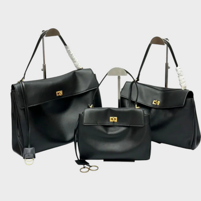Lidia bolso de piel minimalista negro con herrajes dorados