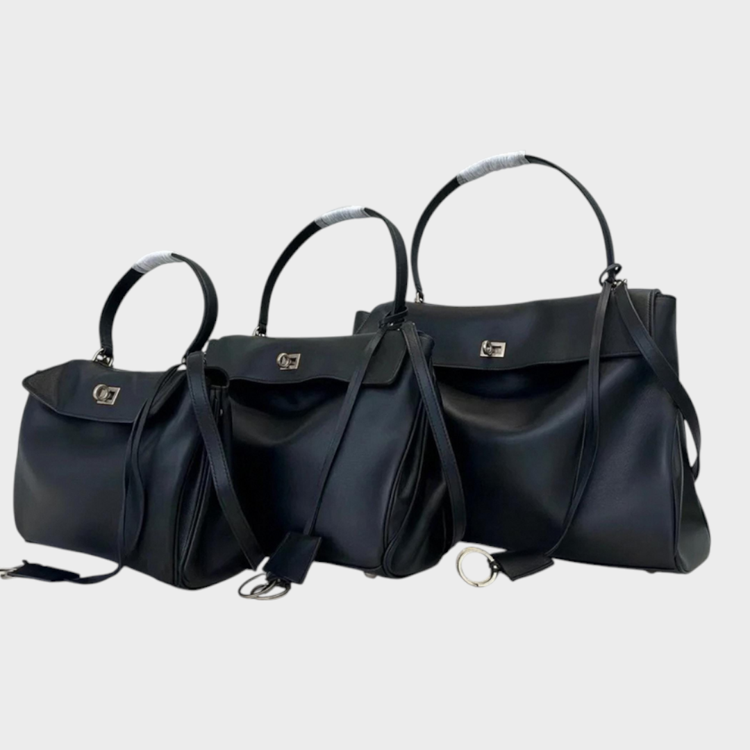 Lidia bolso de piel minimalista negro con hebilla plateada