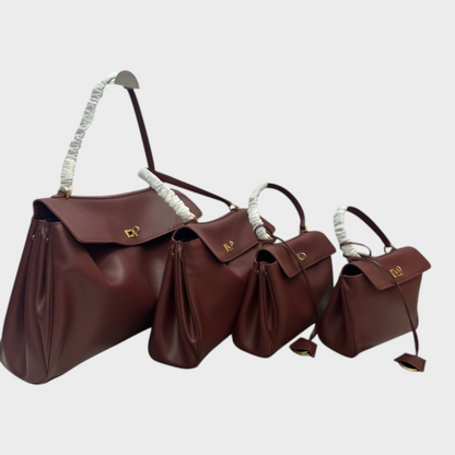 Lidia bolso de piel minimalista burdeos con herrajes dorados